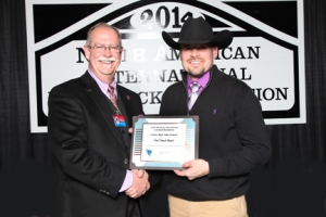 Larry Wilson, NAILE superintendent (left) presents the Fred Francis award to LLCC Agriculture Professor Craig Beckmier