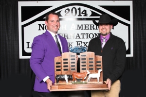 Chris Mullinix, award sponsor (left) presents the Overall Champion Junior College Team Traveling trophy to LLCC Agriculture Professor Craig Beckmier