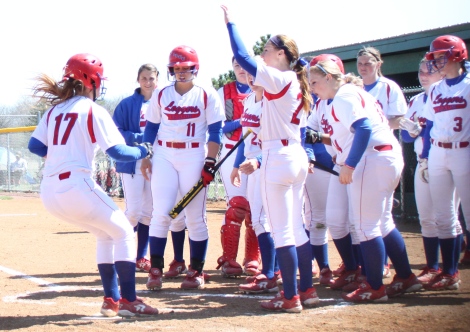 Lincoln Land’s softball team celebrates after Rachel Hastings' home run